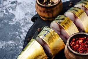 appetizing-smoked-fish-on-kitchen-board-smoked-mackerel-mediterranean-food